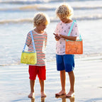 Perfecsy mesh beach toy bag with seashell design, ideal for kids to store sand toys and swimming accessories at the beach.