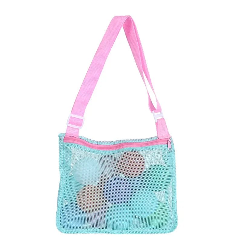 Plush Fashion Hub mesh beach toy bag with seashell design, ideal for kids to store sand toys and swimming accessories.