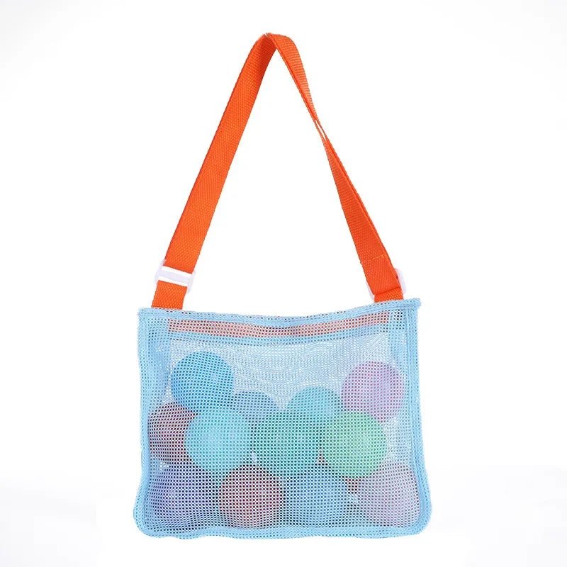 Plush Fashion Hub mesh beach toy bag with seashell design for kids, ideal for storing sand toys and swimming accessories.