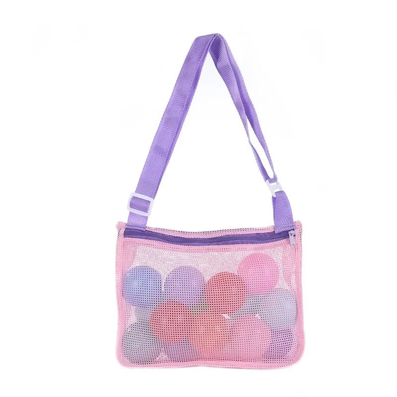 Mesh beach toy bag by Plush Fashion Hub for kids, featuring seashell design, ideal for storing sand toys and swimming accessories.