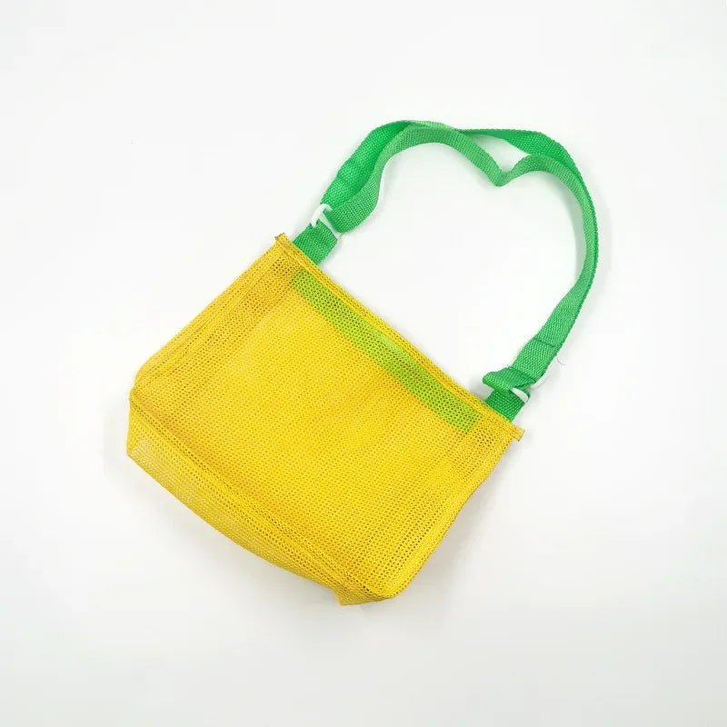 Plush Fashion Hub beach toy mesh bag for kids, featuring seashell design, ideal for storing sand toys and swimming accessories.