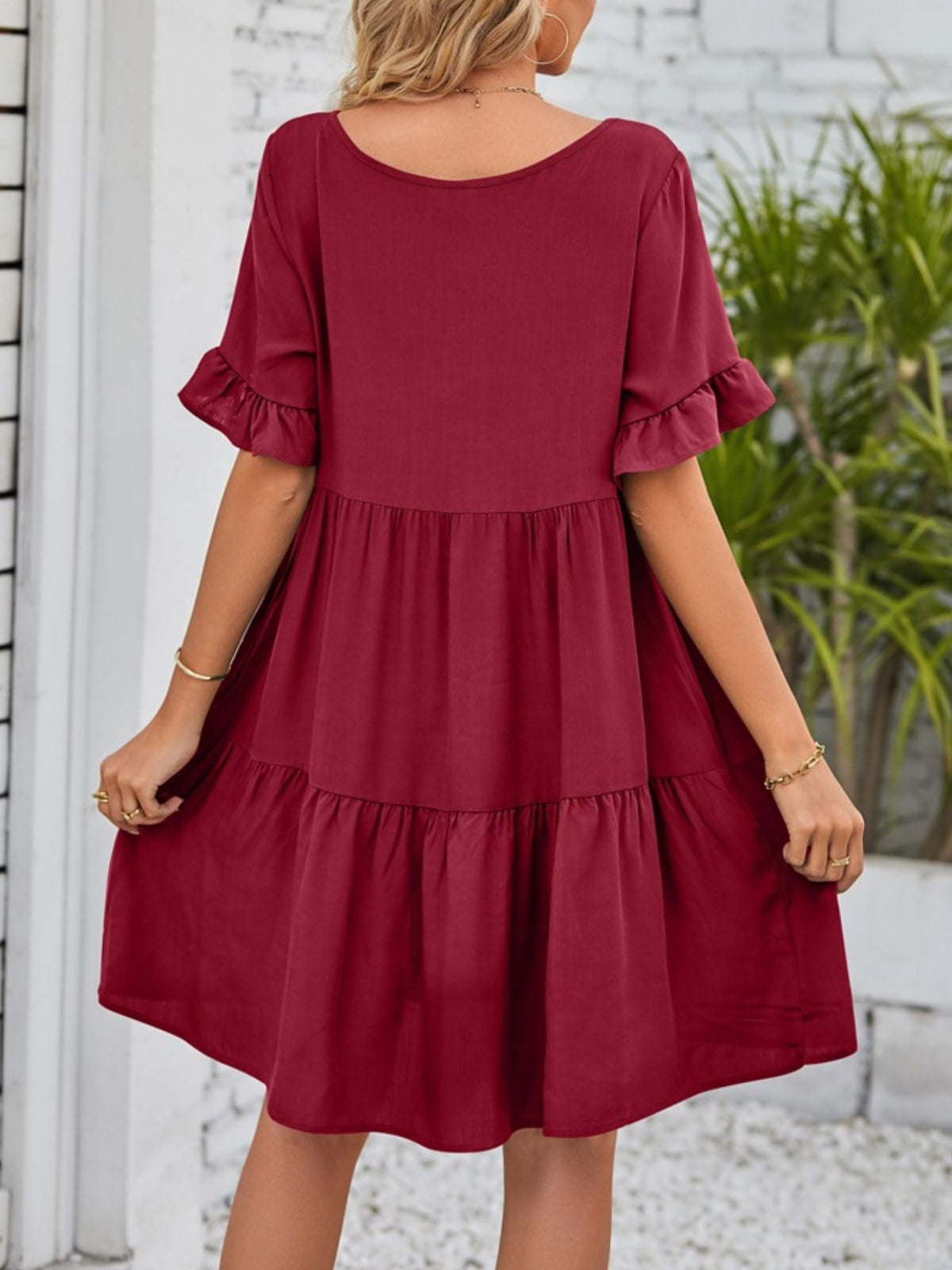 Lightweight rayon ruffled sleeve tiered mini dress with pockets by Plush Fashion Hub, shown in a flowy, stylish design.