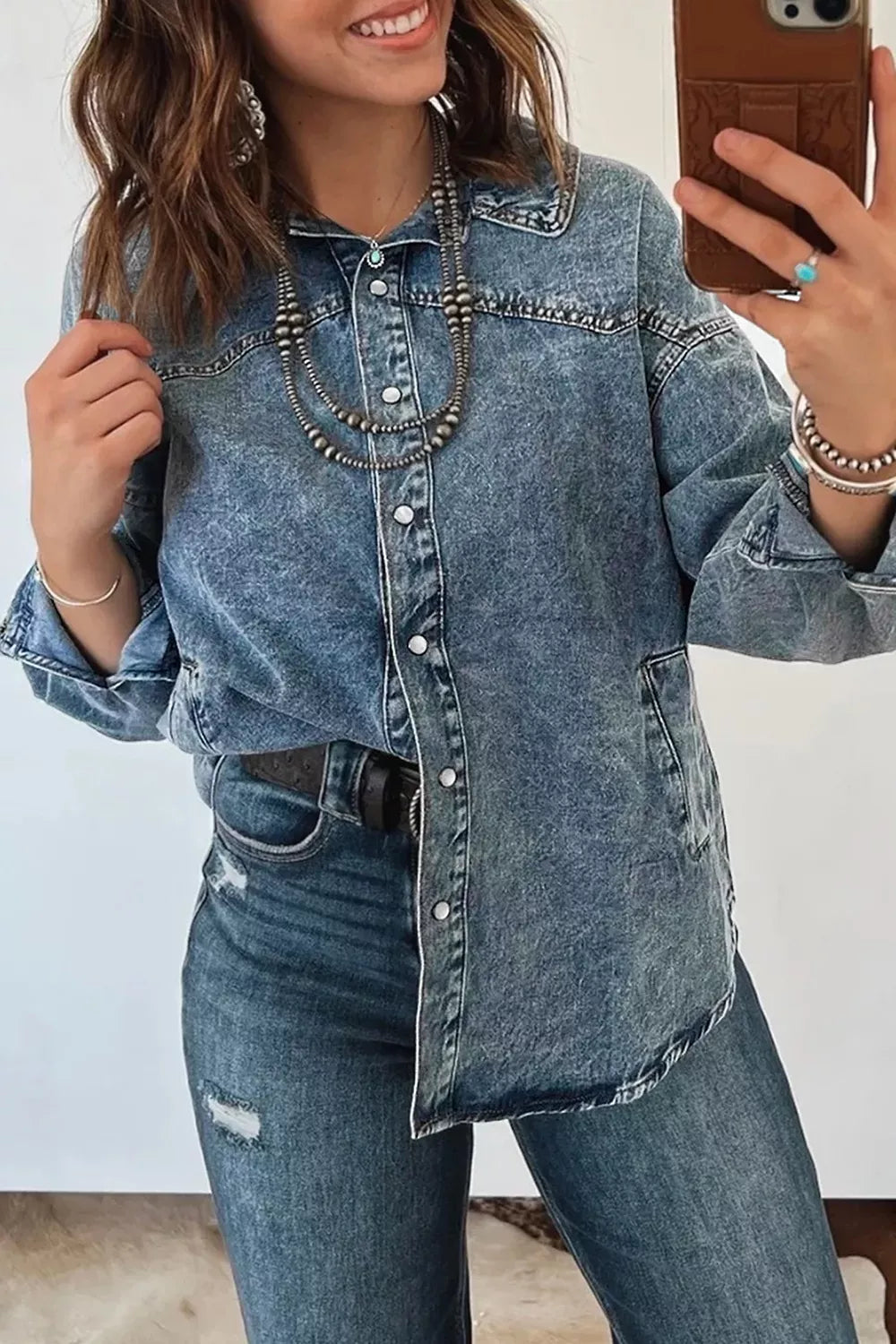 Western long sleeve denim tunic jacket with collar from Trendsi, displayed hanging on a wooden hanger.