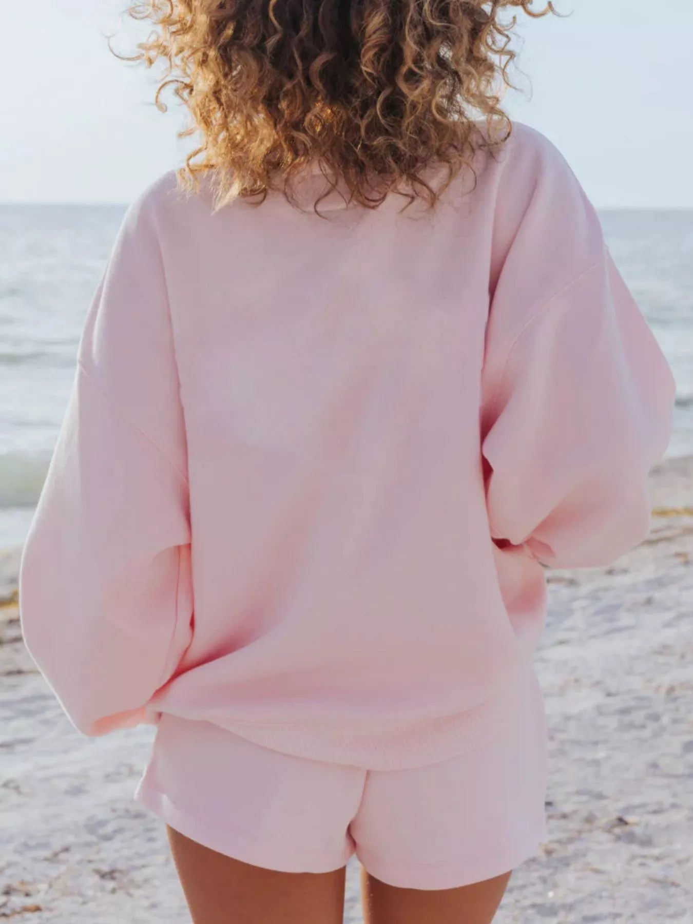 Relaxed fit round neck sweatshirt and shorts set by Trendsi, casual 2-piece loungewear set with comfortable fabric.