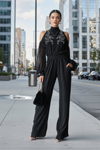 Black embroidered women's long-sleeve wide-leg jumpsuit from FitiqueFit, featuring casual style and relaxed fit with detailed embroidery.