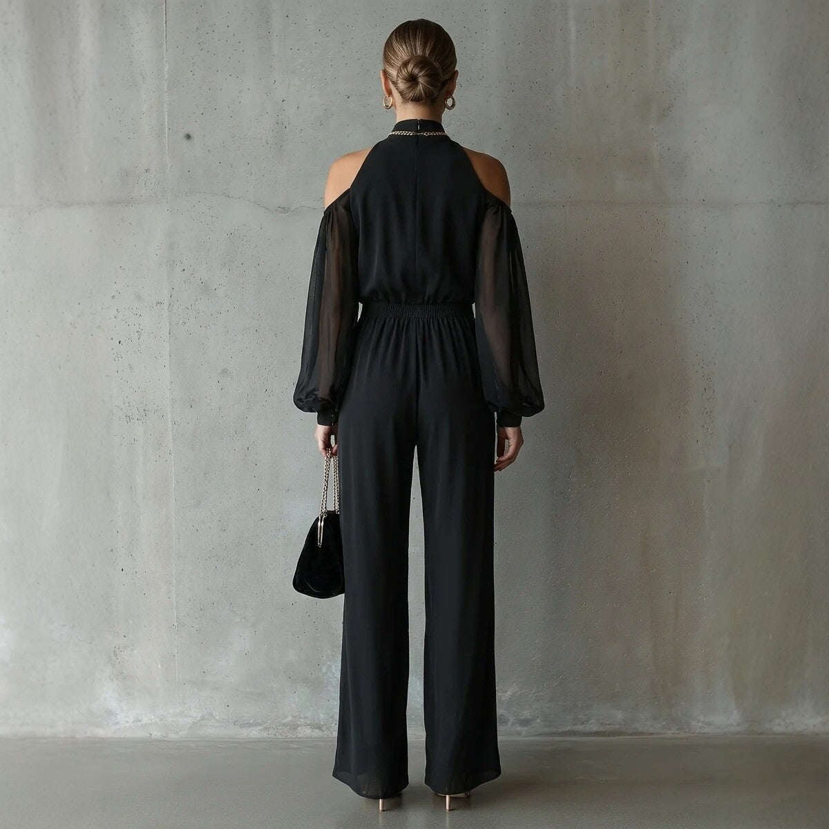 Black embroidered women's long-sleeve wide-leg jumpsuit by FitiqueFit, featuring casualwear style and comfortable fit.