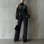 Black embroidered women's long-sleeve wide-leg jumpsuit by FitiqueFit, showcasing casualwear with intricate embroidery and flowing wide-leg design.