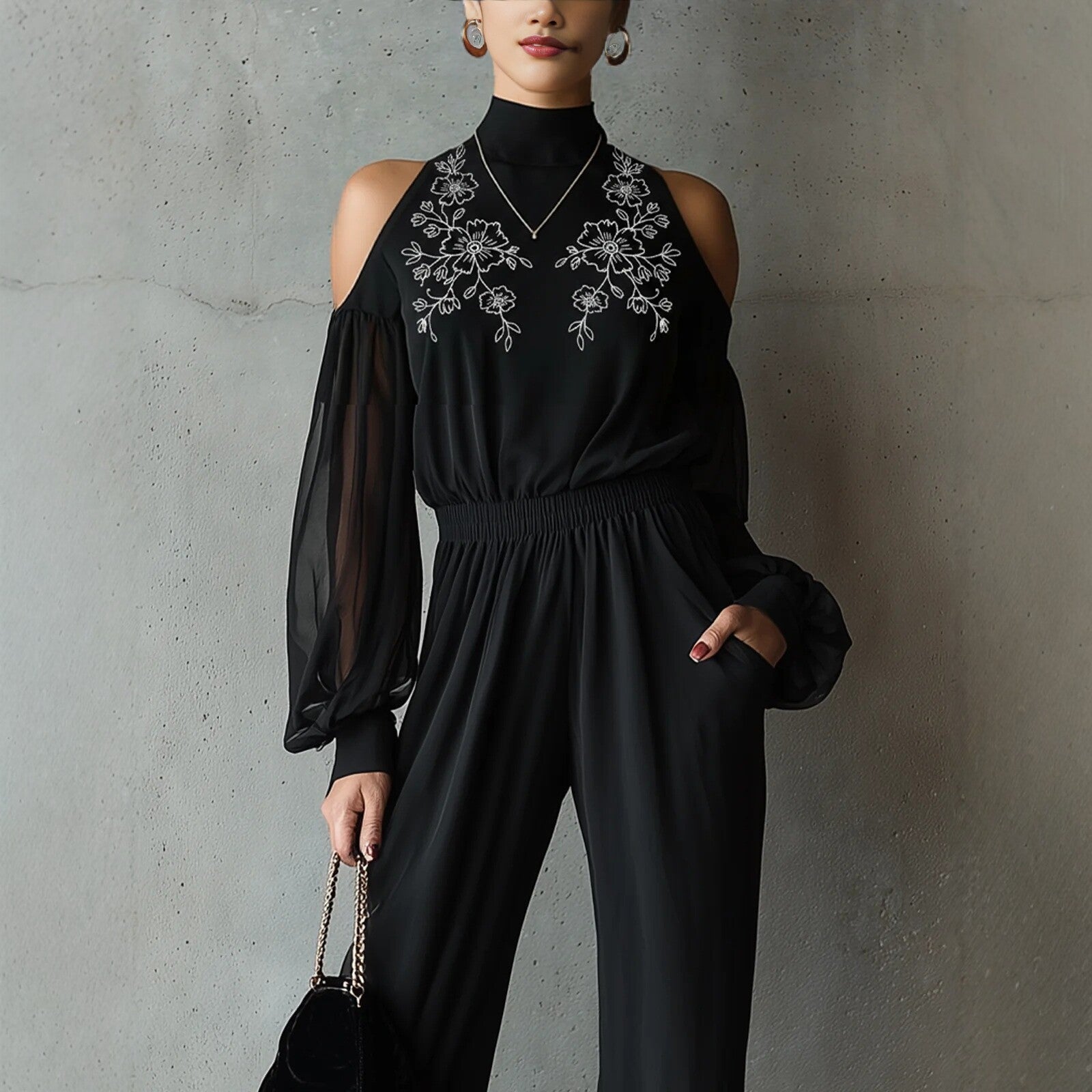 Black embroidered women's long-sleeve wide-leg jumpsuit by FitiqueFit, showcasing a stylish casualwear outfit with intricate embroidery details.