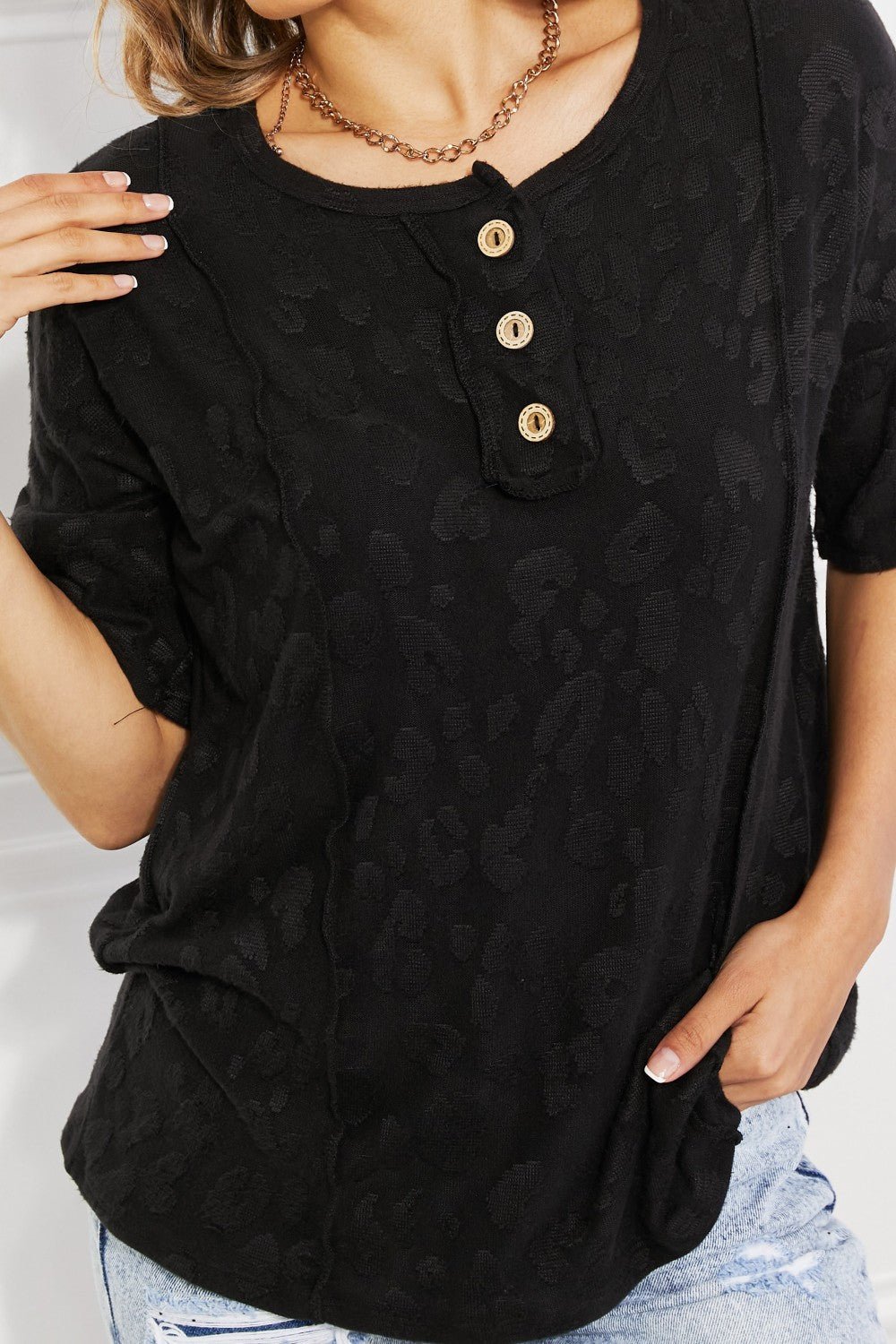 Black women's animal textured half sleeve casual tee by Plush Fashion Hub, featuring soft stretch fabric and stylish design.