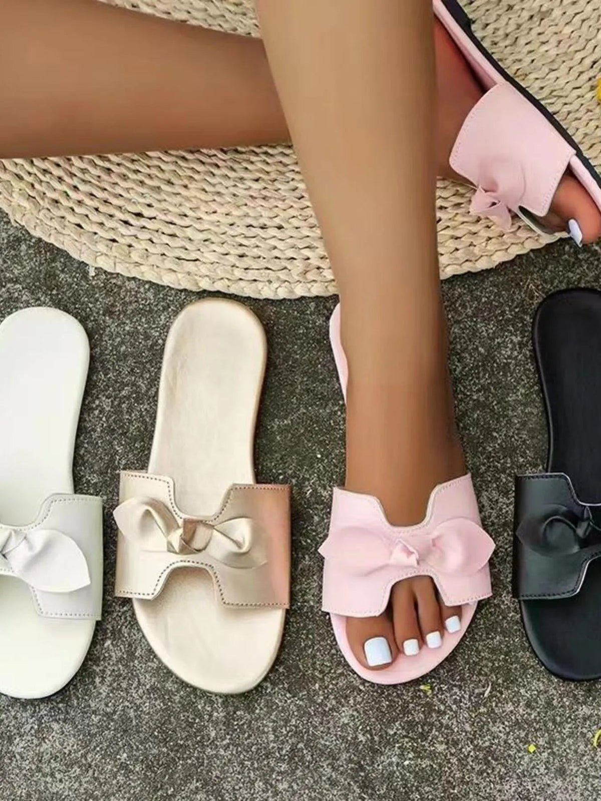 Elegant women's flat sandals with bow detail, comfortable slip-on design, made of PU leather by Plush Fashion Hub.