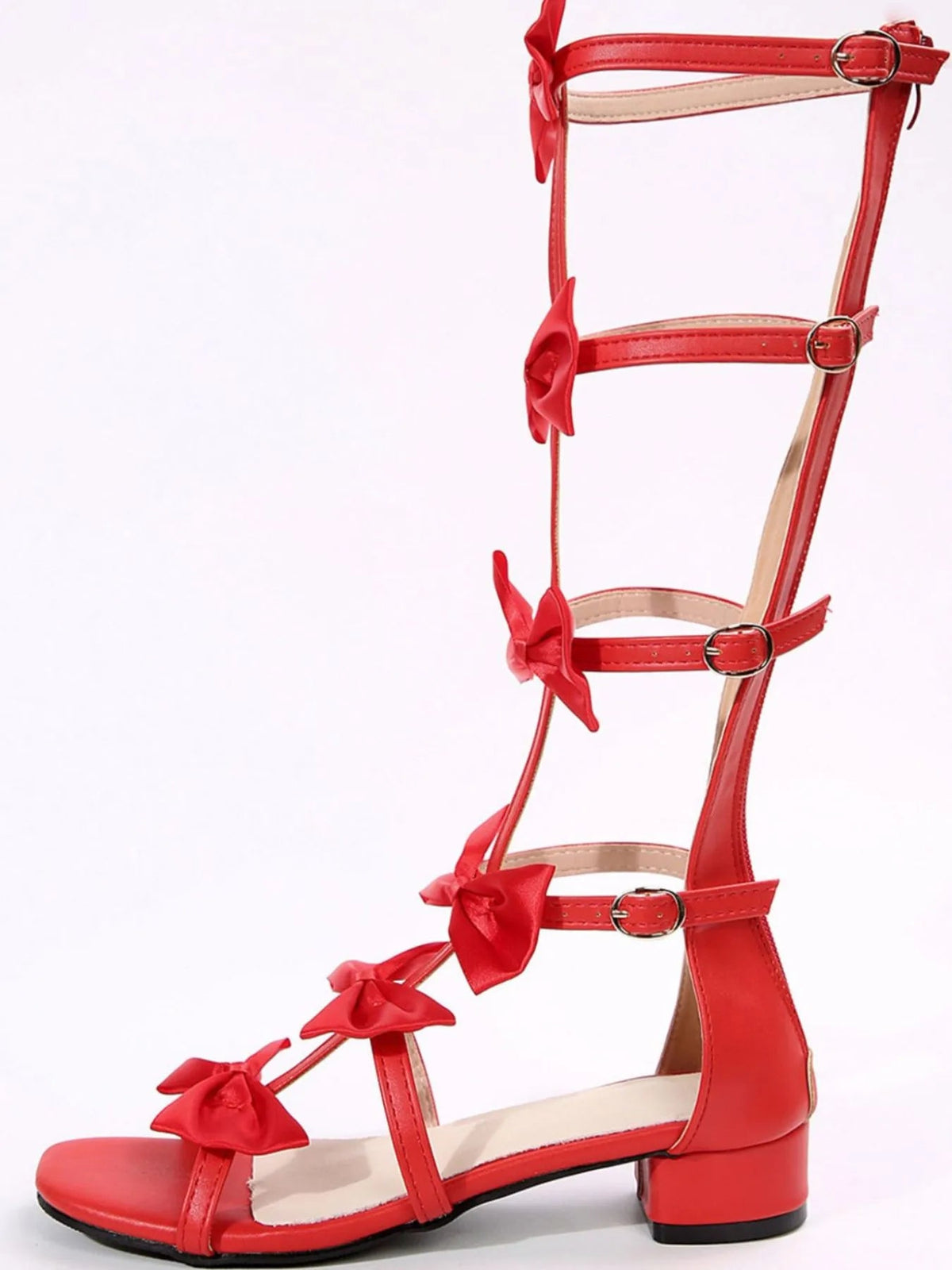 Elegant women's slip-on dress sandals with a bow detail and low heel, crafted by Plush Fashion Hub.