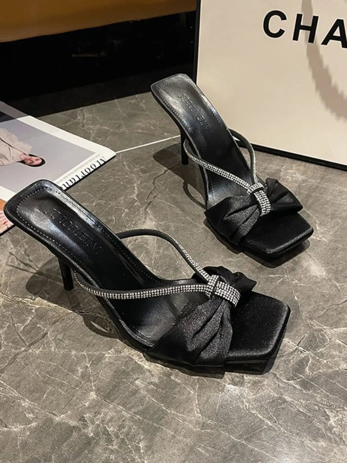 Elegant faux leather mid-heel sandals with bow detail for women, featuring a stylish and comfortable design from Plush Fashion Hub.