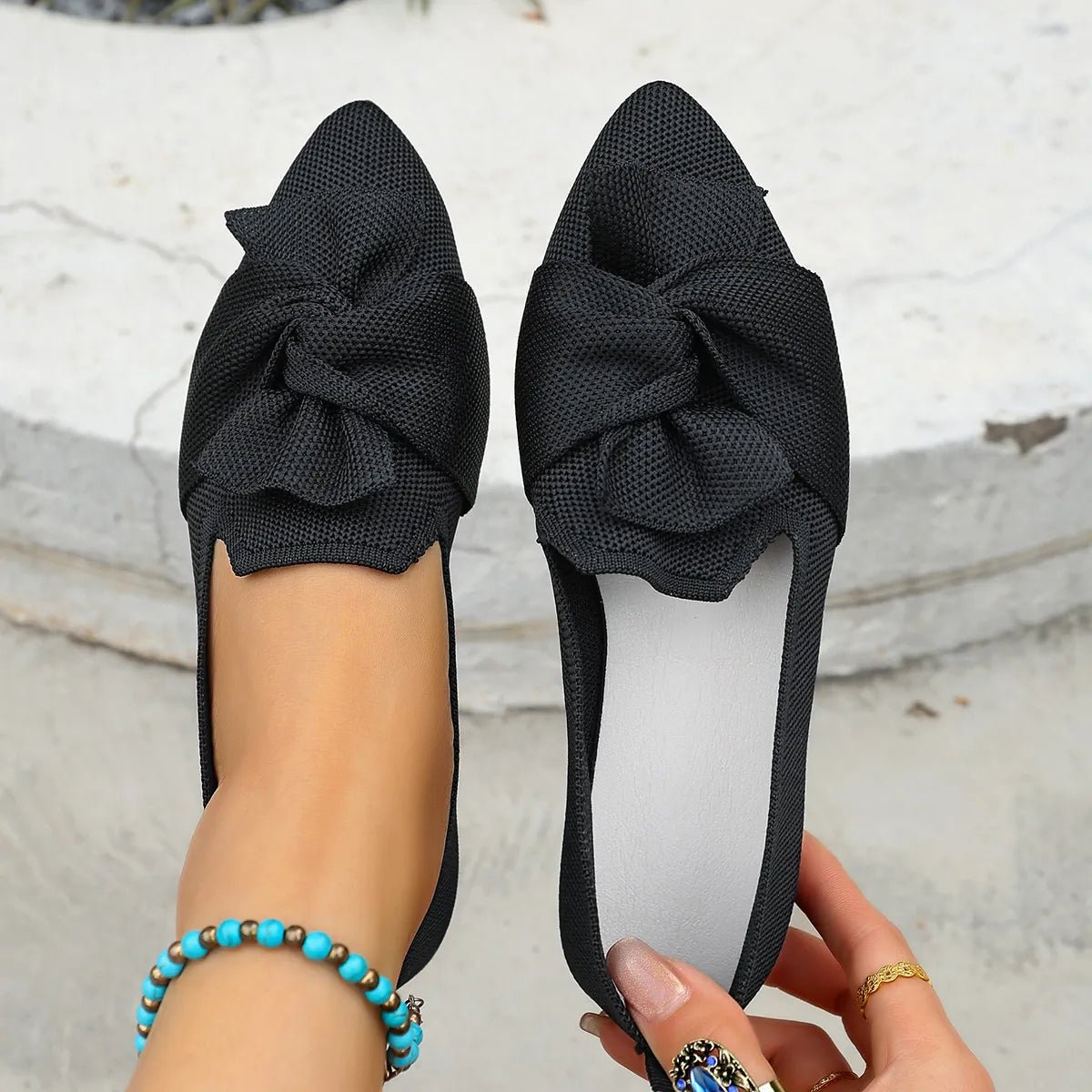 Elegant Plush Fashion Hub bow embellished pointed toe flat slip-on shoes, featuring a stylish design and comfortable fit.