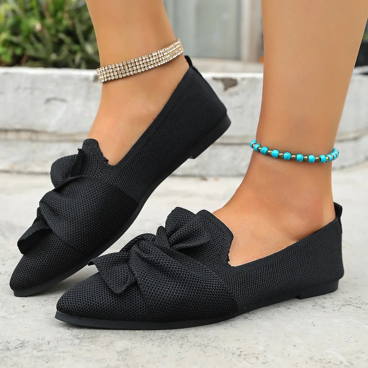 Elegant plush fashion hub pointed toe flats with bow embellishment, slip-on shoe designed for stylish comfort.