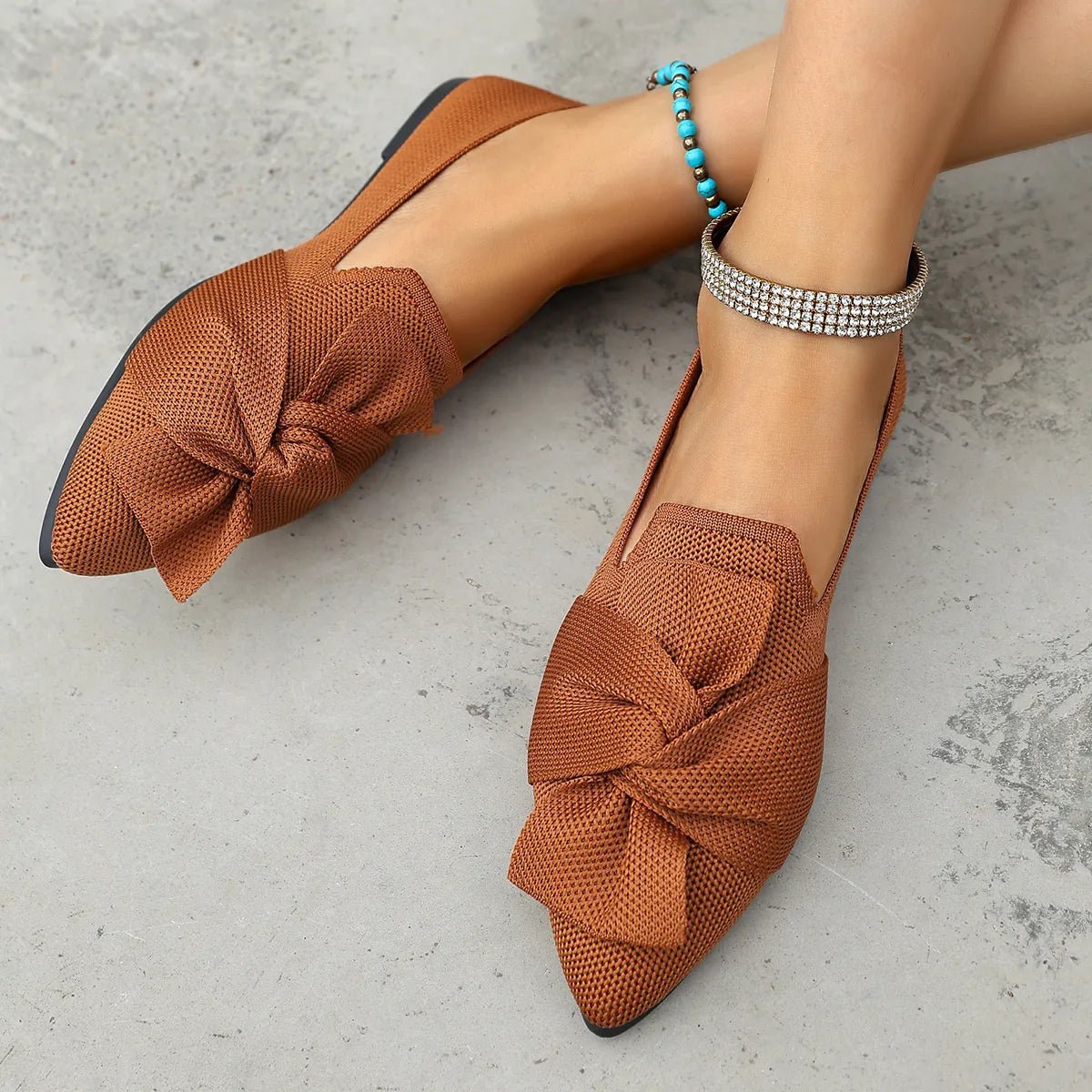 Elegant plush fashion hub pointed toe flats with bow embellishments, slip-on design, perfect for stylish everyday wear.