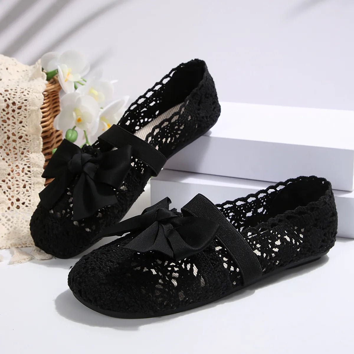 Women's chic round toe bow slip-on flats by Trendsi, featuring breathable mesh material and comfortable shoe design.