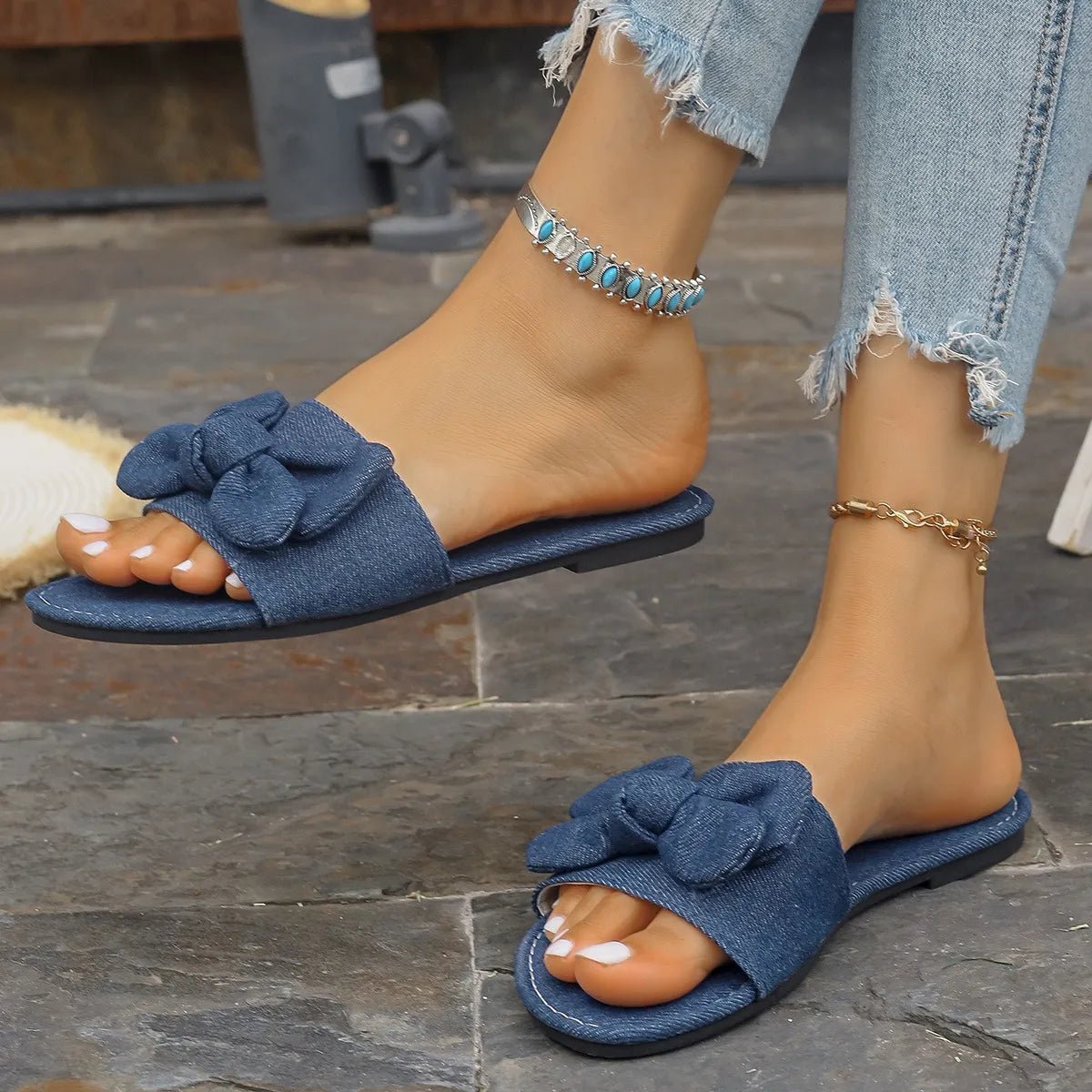 Women's denim flat sandals with bow tie detail, casual PU leather shoes from Trendsi, comfortable slip-on footwear for warm weather.