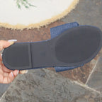 Women's denim flat sandals with bow tie detail, casual PU leather shoes by Trendsi, comfortable slip-on footwear for warm weather.