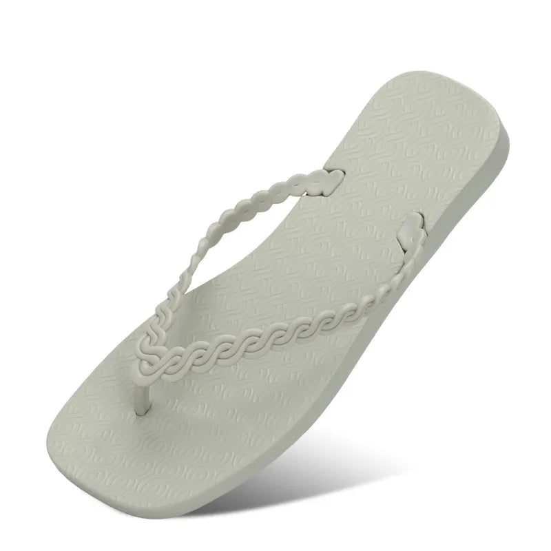 Women's braided strap beach sandals with toe post, comfortable summer flip flops by Trendsi, ideal for casual beachwear.