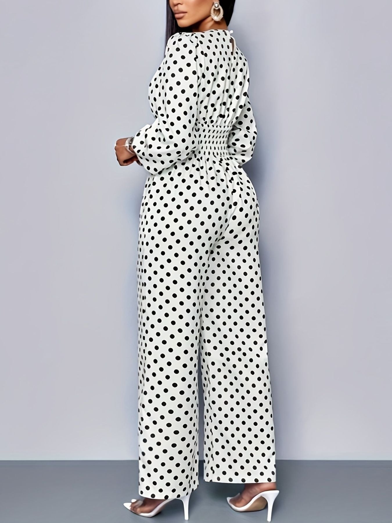 Women's polka dot long sleeve wide leg jumpsuit with pockets, stylish and comfortable Trendsi jumpsuit, full-length view.