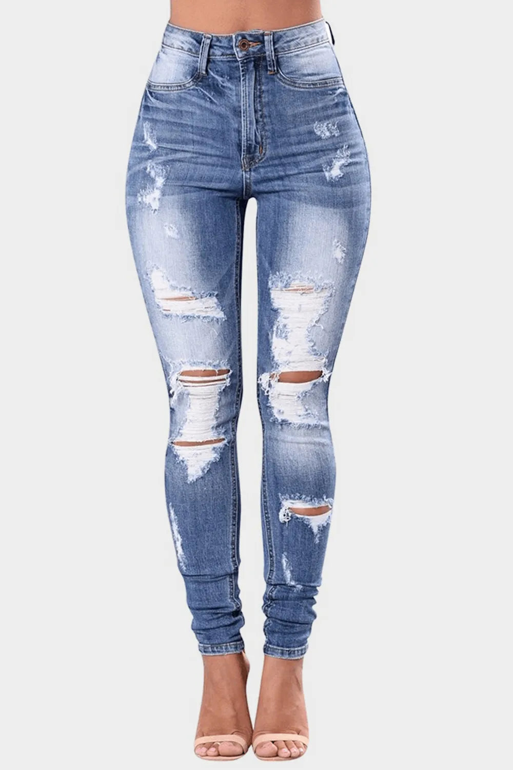 Plus size full distressed skinny denim jeans from Trendsi, featuring a fitted silhouette and distressed details.