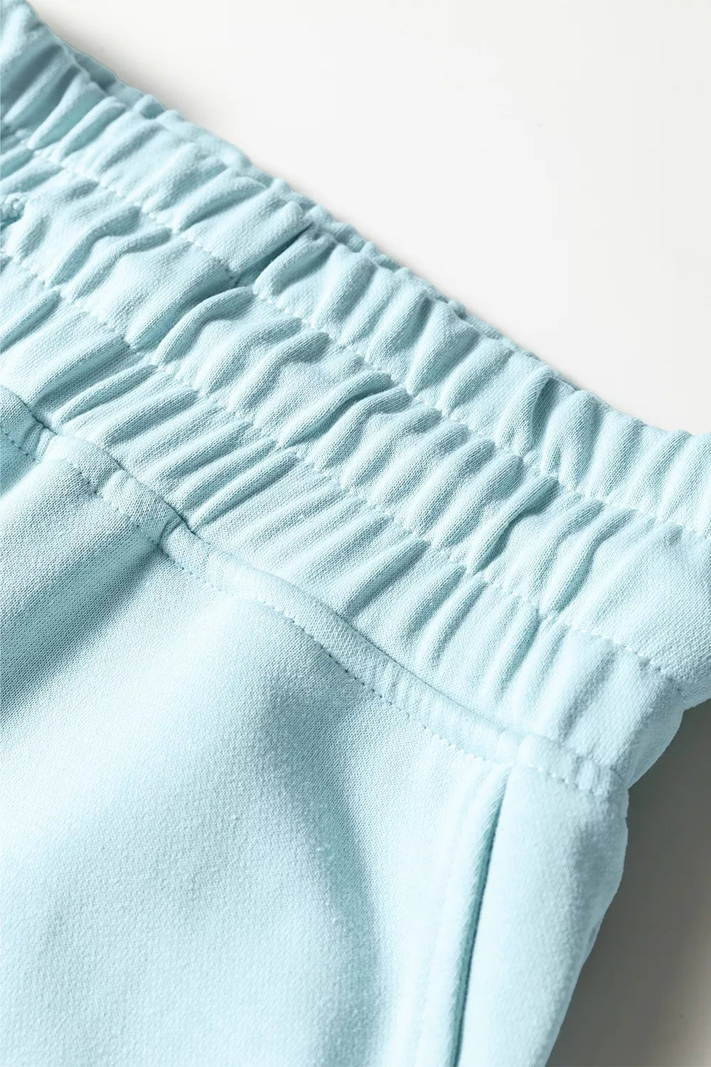 Drop shoulder puff sleeve crop pullover and wide-leg pants set by Trendsi, featuring stylish, comfortable matching clothing in a modern design.