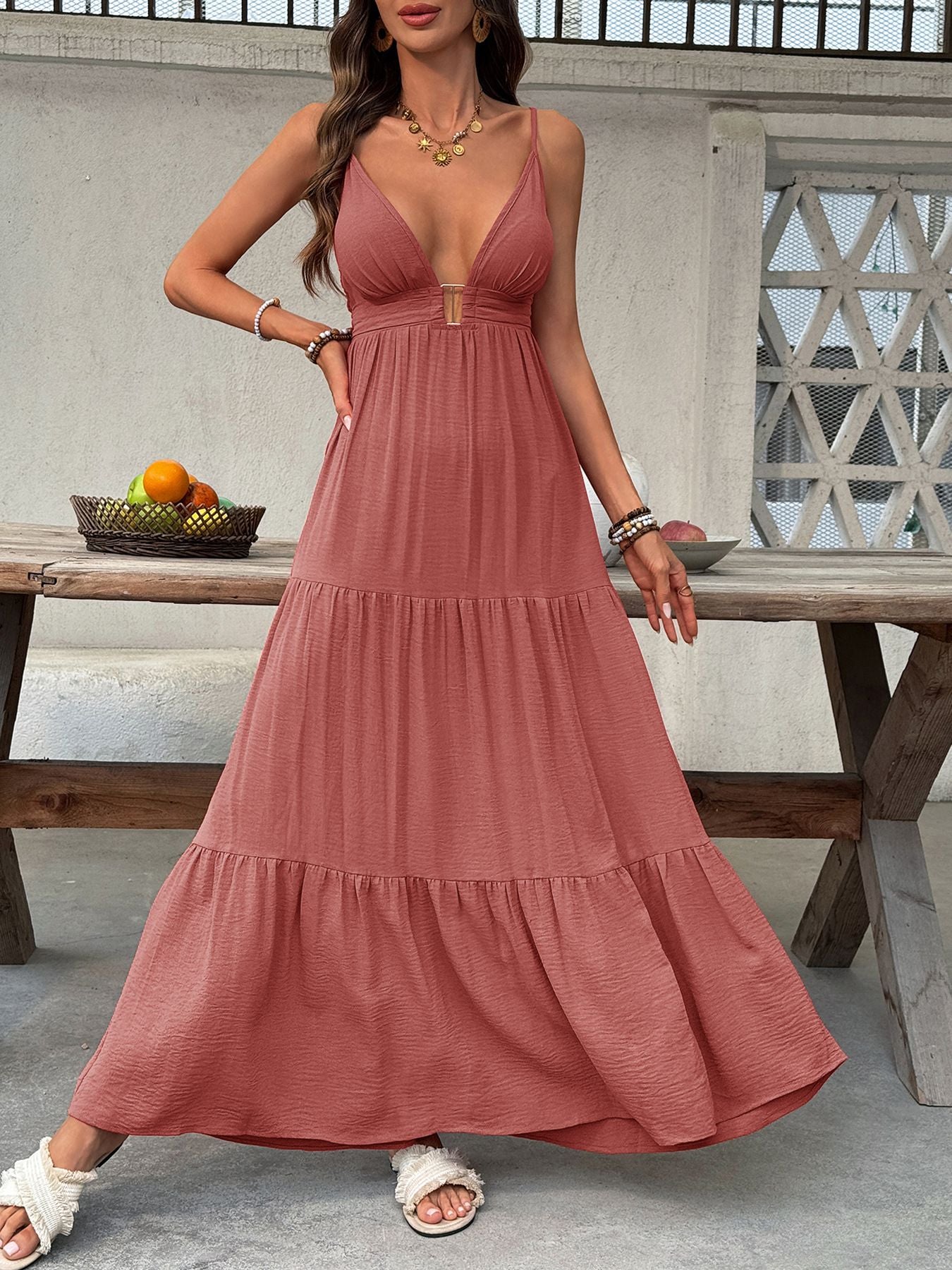 Women's deep V-neck tiered maxi dress by Trendsi, flowy boho beach dress with smocked details and a layered skirt.