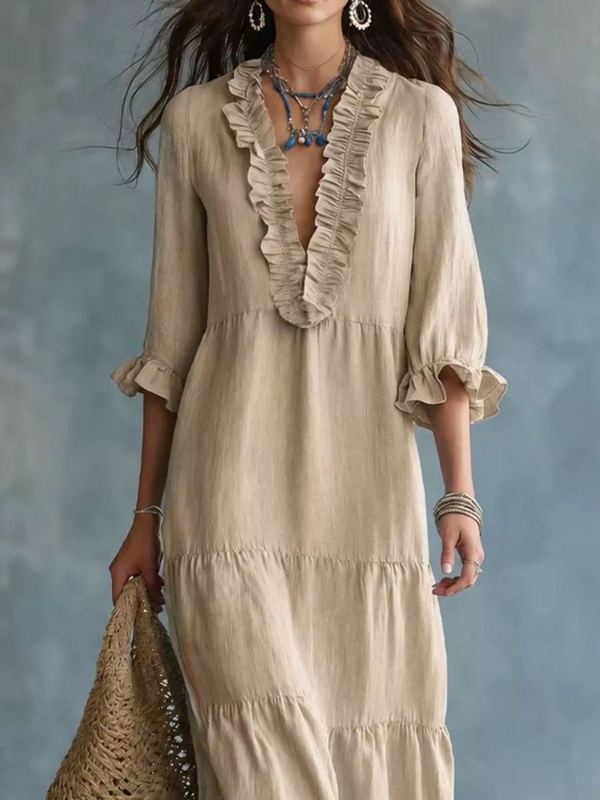 Ruffled V-neck tiered maxi dress by Trendsi, flowing fabric with ruffle details and a V-neckline, perfect for elegant occasions.