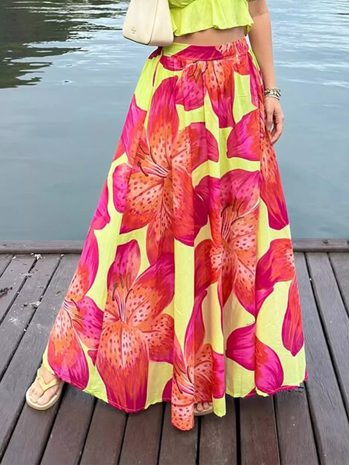 Women's lightweight boho floral print flowy maxi skirt with pockets by Plush Fashion Hub, featuring a relaxed fit and vibrant floral design.