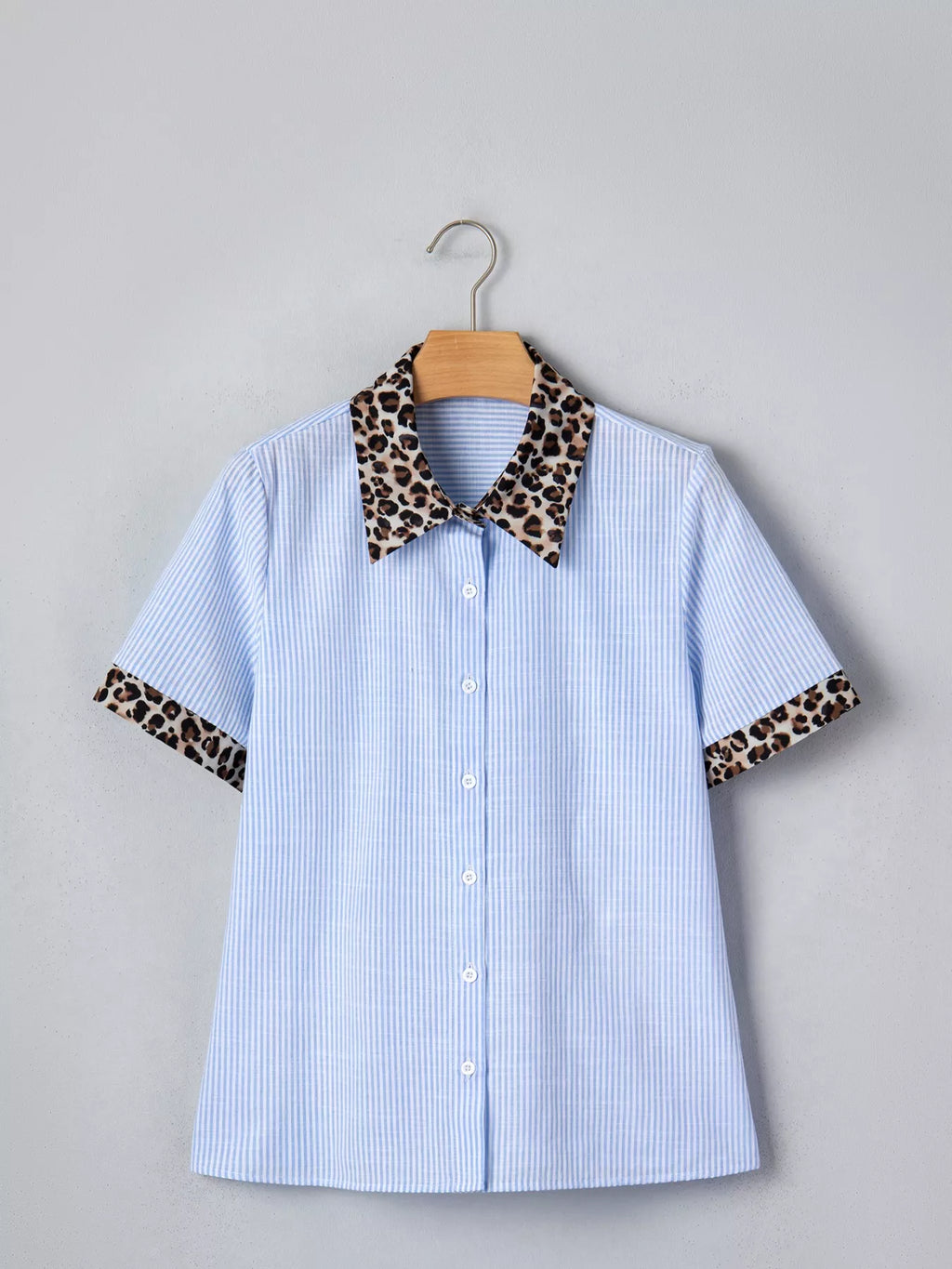 Women's leopard print short sleeve dress with contrast collar, stylish trendy shirt from Trendsi, featuring bold animal pattern and collar detail.