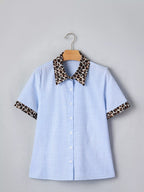 Women's leopard print short sleeve dress with contrast collar, stylish trendy shirt from Trendsi, featuring bold animal pattern and collar detail.