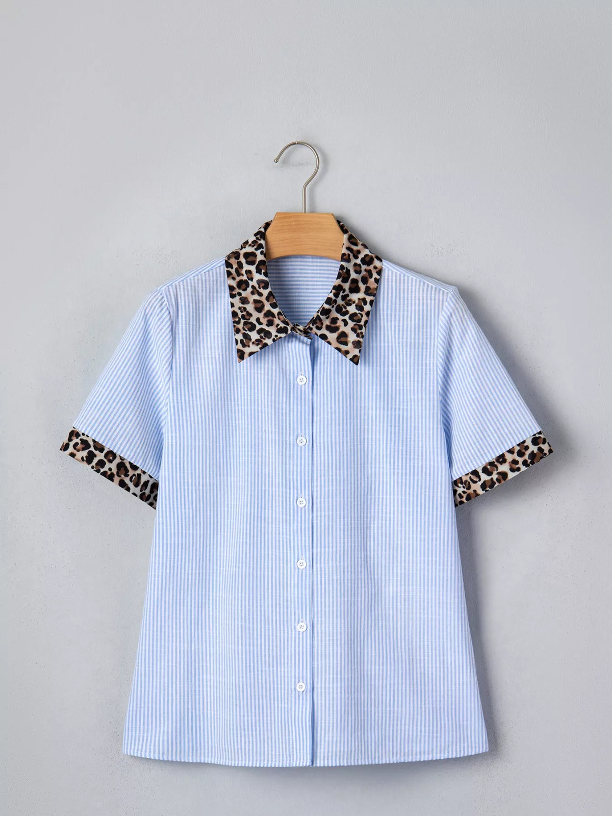 Women's leopard print short sleeve dress with contrast collar from Plush Fashion Hub, featuring a stylish and comfortable design.