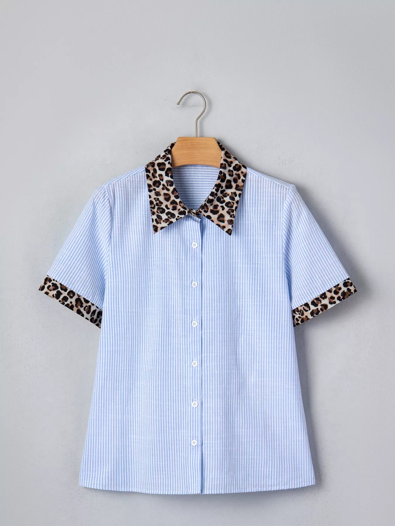 Women's leopard print short sleeve dress with contrast collar, stylish trendy shirt from Trendsi, featuring bold animal pattern and collar detail.