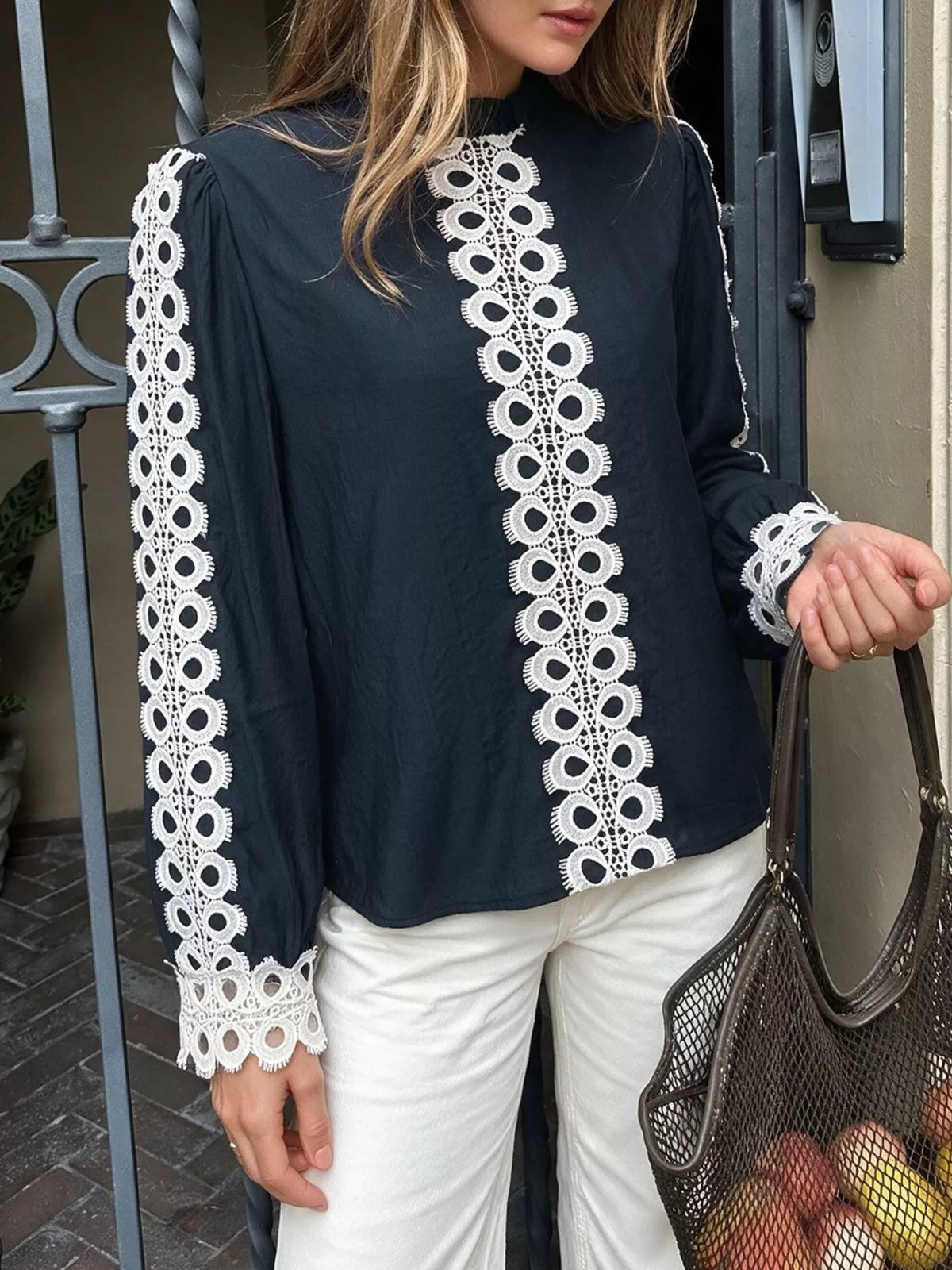 Lace trim long sleeves blouse from Trendsi, featuring delicate lace details and a soft fabric in a stylish, feminine design.