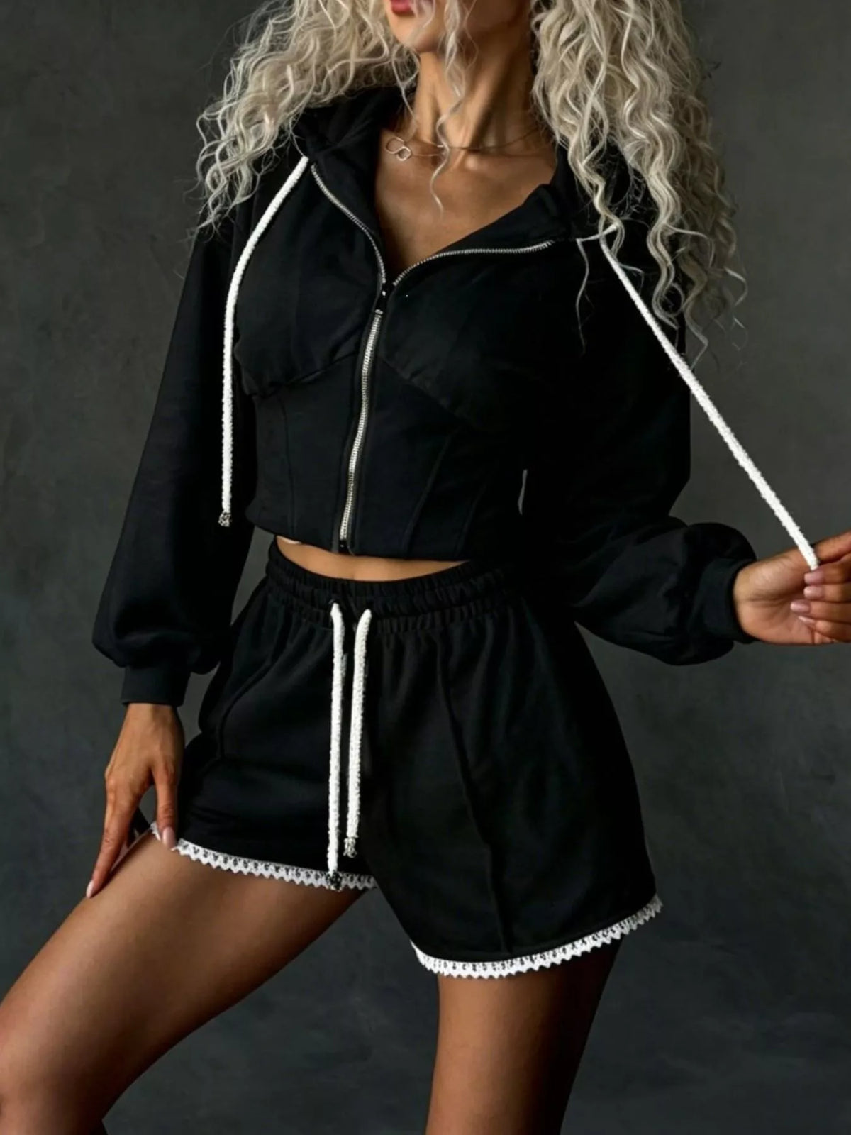 Plush Fashion Hub zip-up hooded outerwear and shorts set, featuring soft fabric, hood, and matching shorts for casual wear.