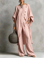 Women’s casual drop shoulder three-quarter sleeve irregular shirt and matching pants set by FitiqueFit displayed on model.