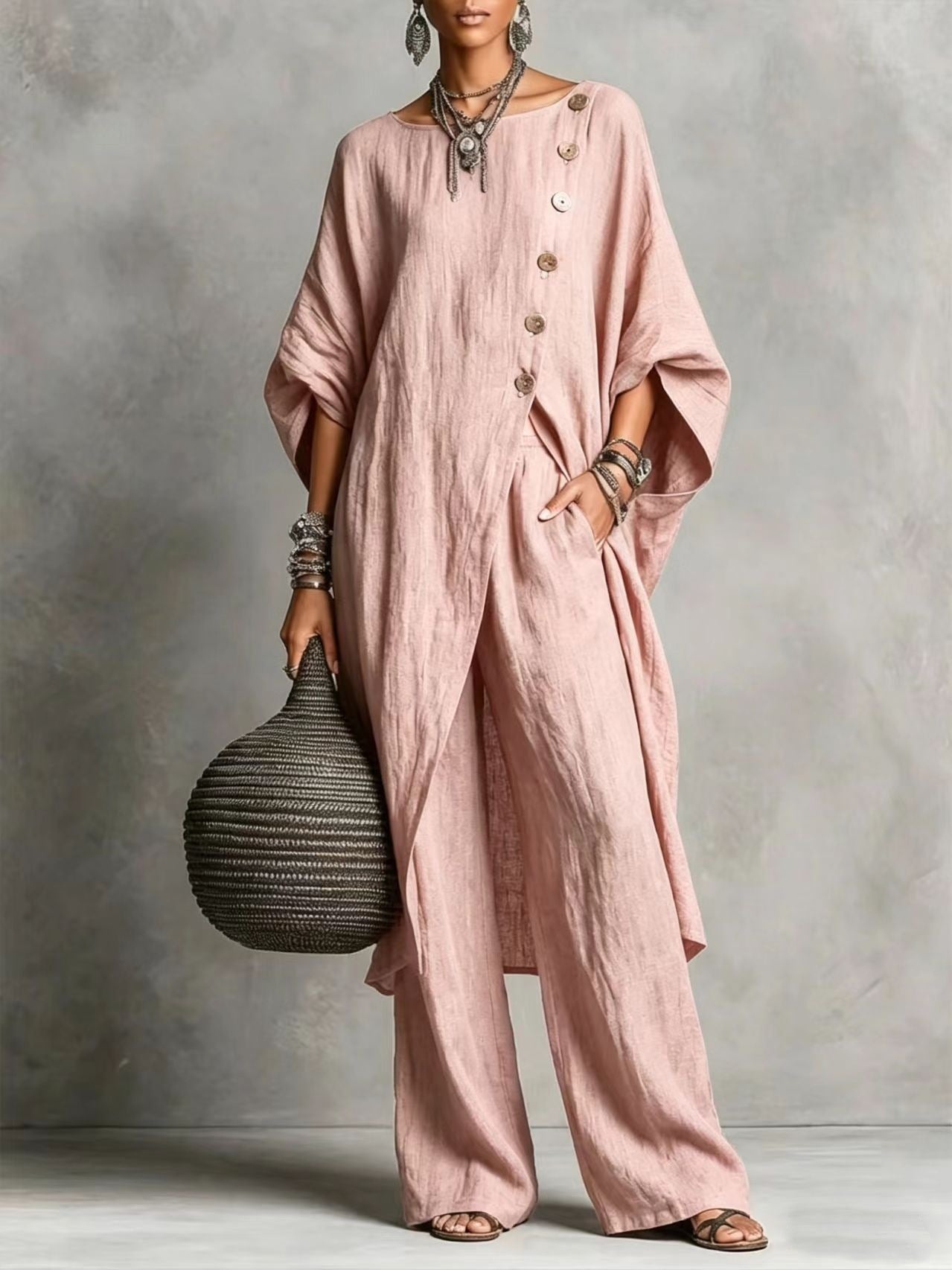 Women’s casual drop shoulder three-quarter sleeve irregular shirt and matching pants set by FitiqueFit displayed on model.