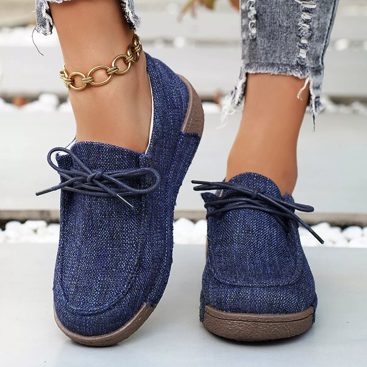 Round toe lace-up sneakers from Trendsi, stylish casual footwear with white soles and breathable fabric upper.