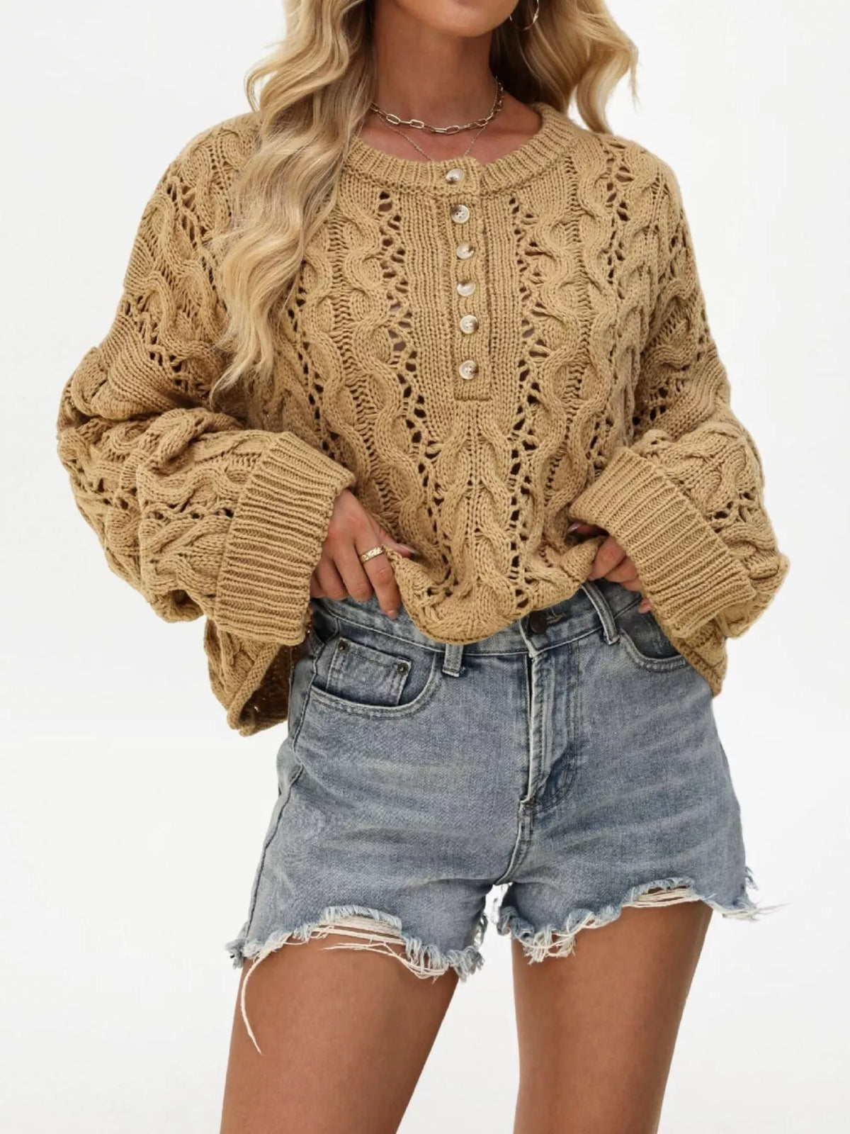 Chic cable knit half-button openwork sweater by Trendsi featuring a cozy design and textured knit pattern.