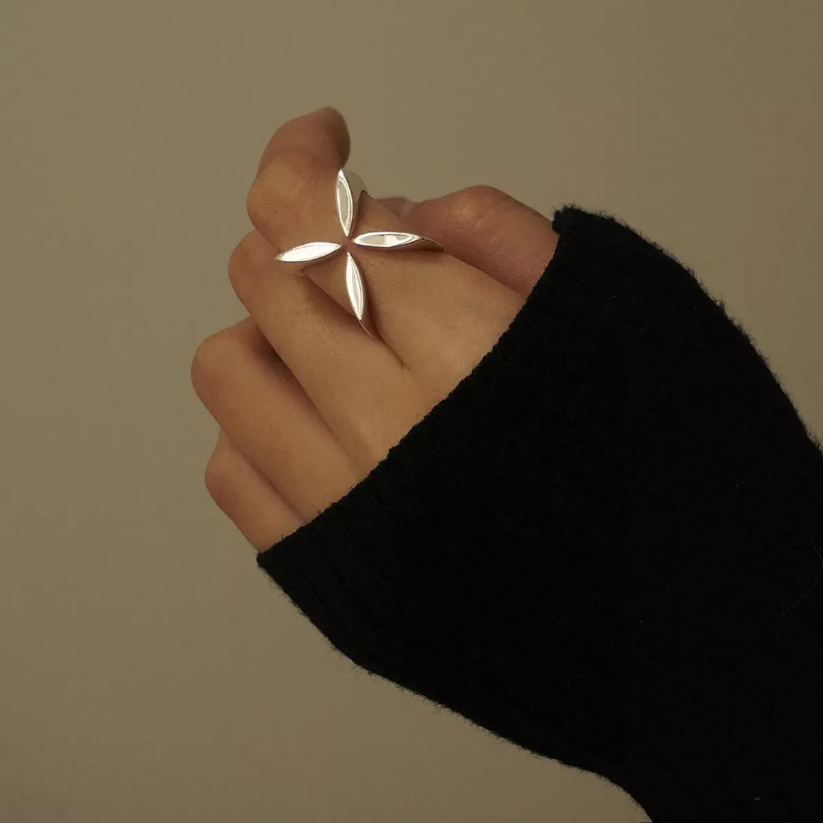 Stainless steel crisscross open ring with sleek design, crafted by Plush Fashion Hub, perfect for stylish everyday wear.