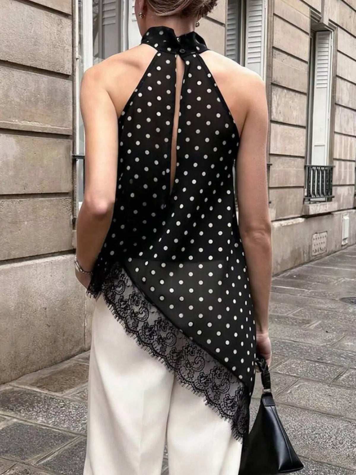 Polka dot lace trim sleeveless blouse with asymmetrical hem by Plush Fashion Hub, featuring a stylish fit and delicate lace details.