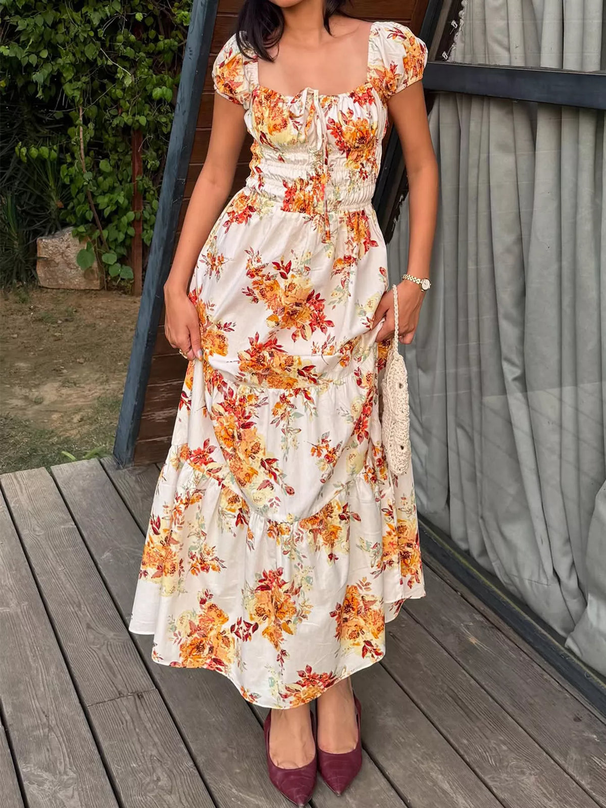 Women’s floral print short sleeve ruched maxi dress by Plush Fashion Hub, featuring vibrant floral pattern and flowy fabric.
