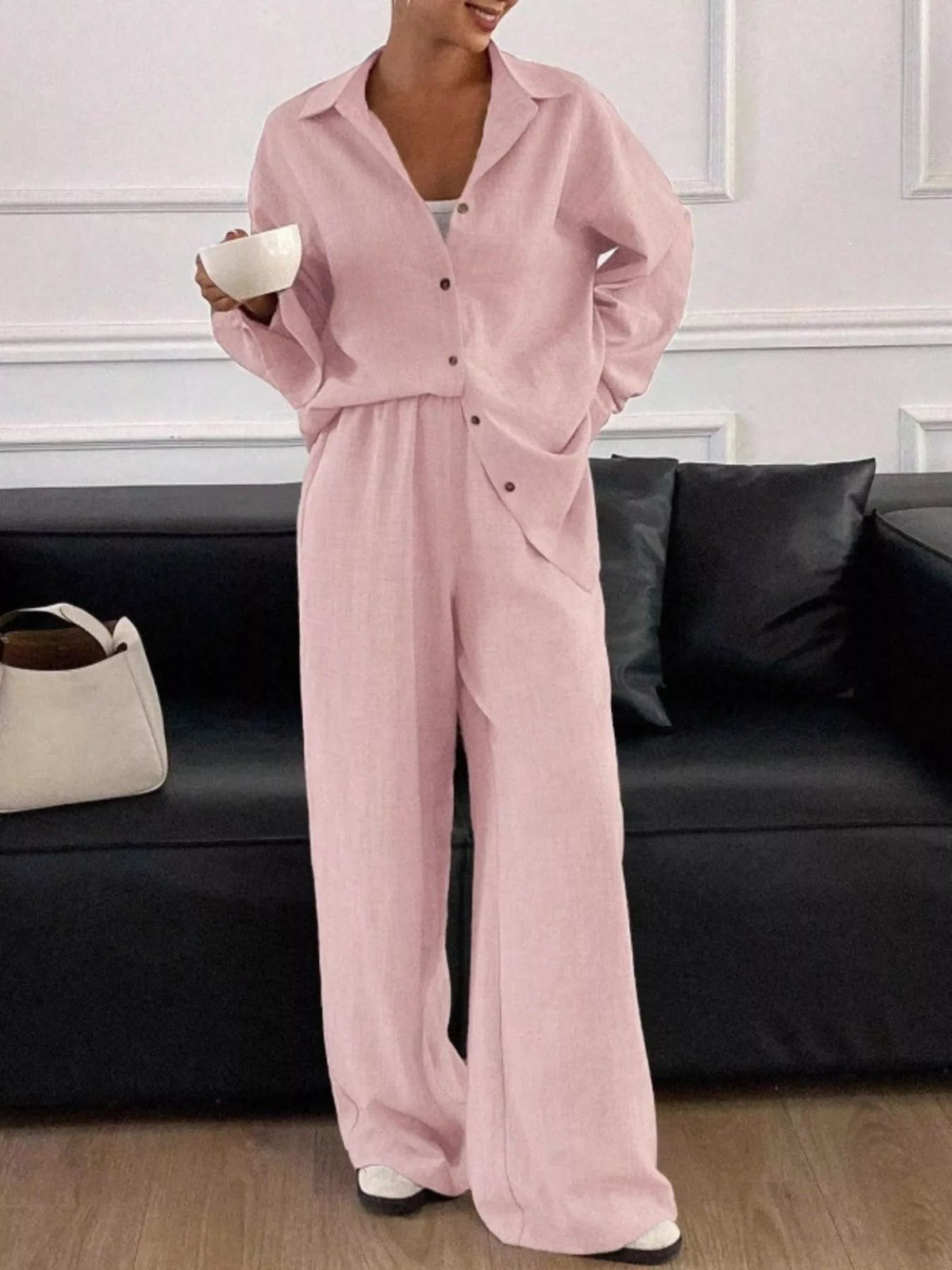 Trendsi long sleeve button-up shirt and wide-leg pants set, featuring a stylish coordinated outfit with a sleek fit and modern design.