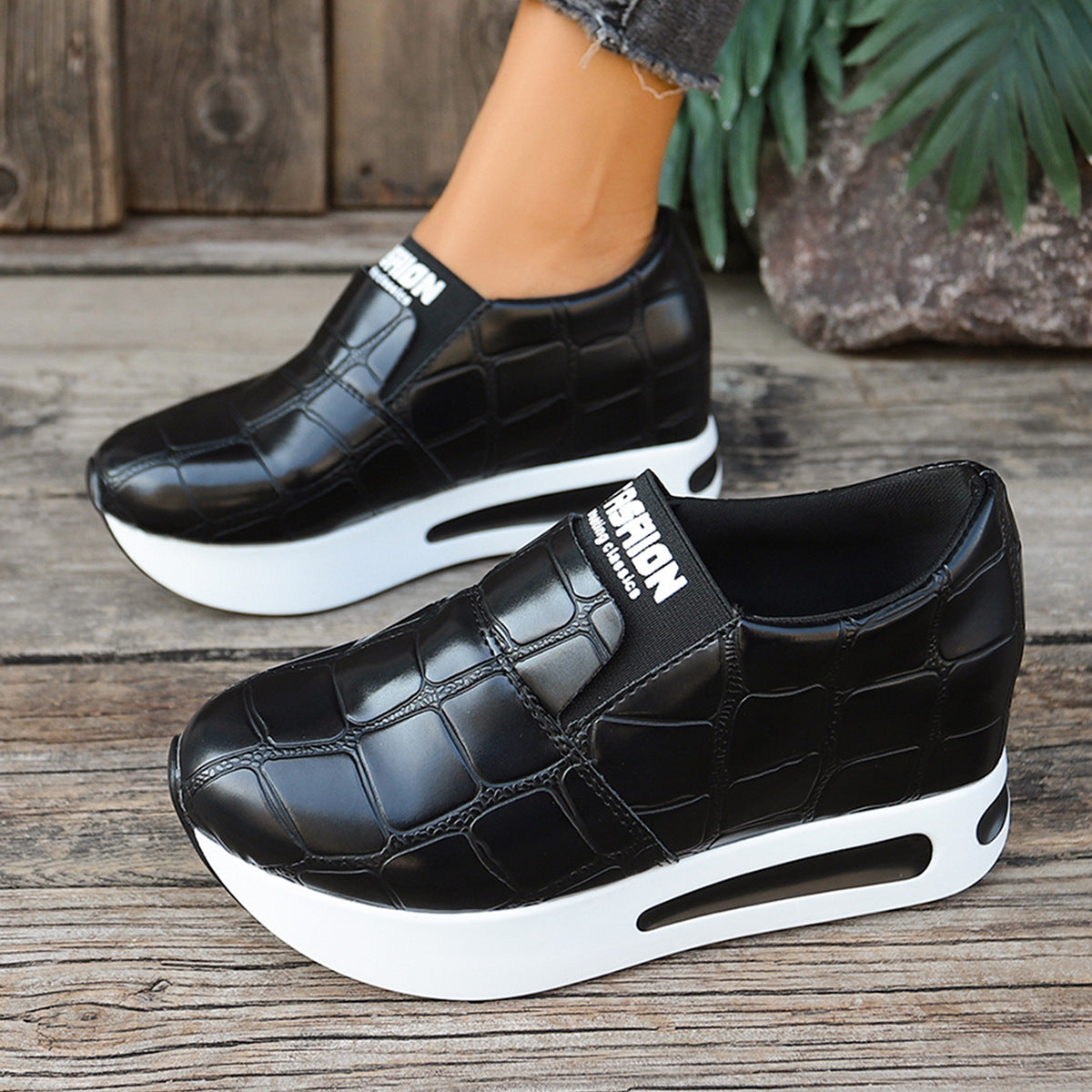 Women's faux leather crocodile pattern platform slip-on sneakers by Plush Fashion Hub, showing textured design and chunky sole.