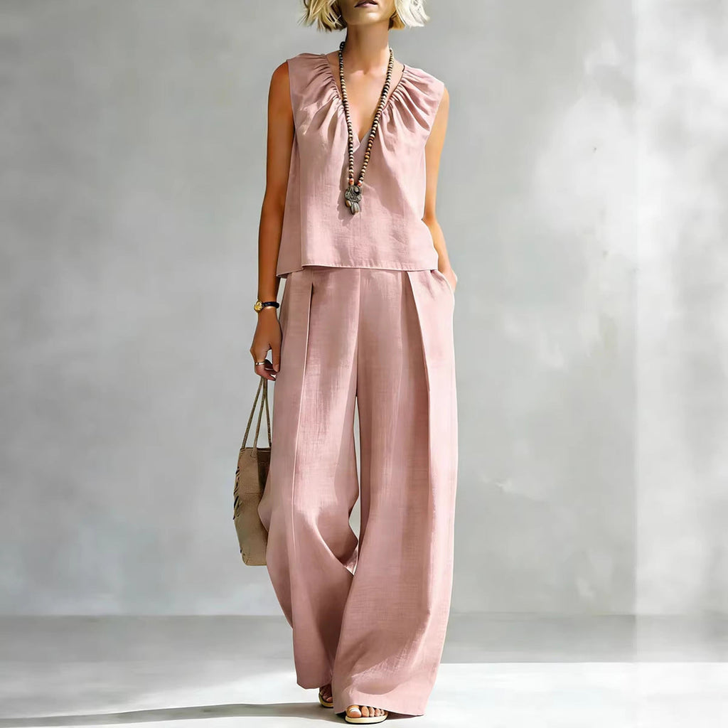 Women's sleeveless cotton-linen shirt and pants set by FitiqueFit, casual urban two-piece outfit, shown in light fabric and relaxed fit.