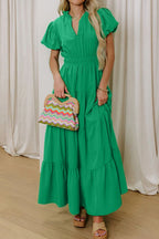 Women's ruffled tiered puff sleeve maxi dress with floral pattern, elegant long dress from Trendsi, featuring flowing fabric and feminine design.