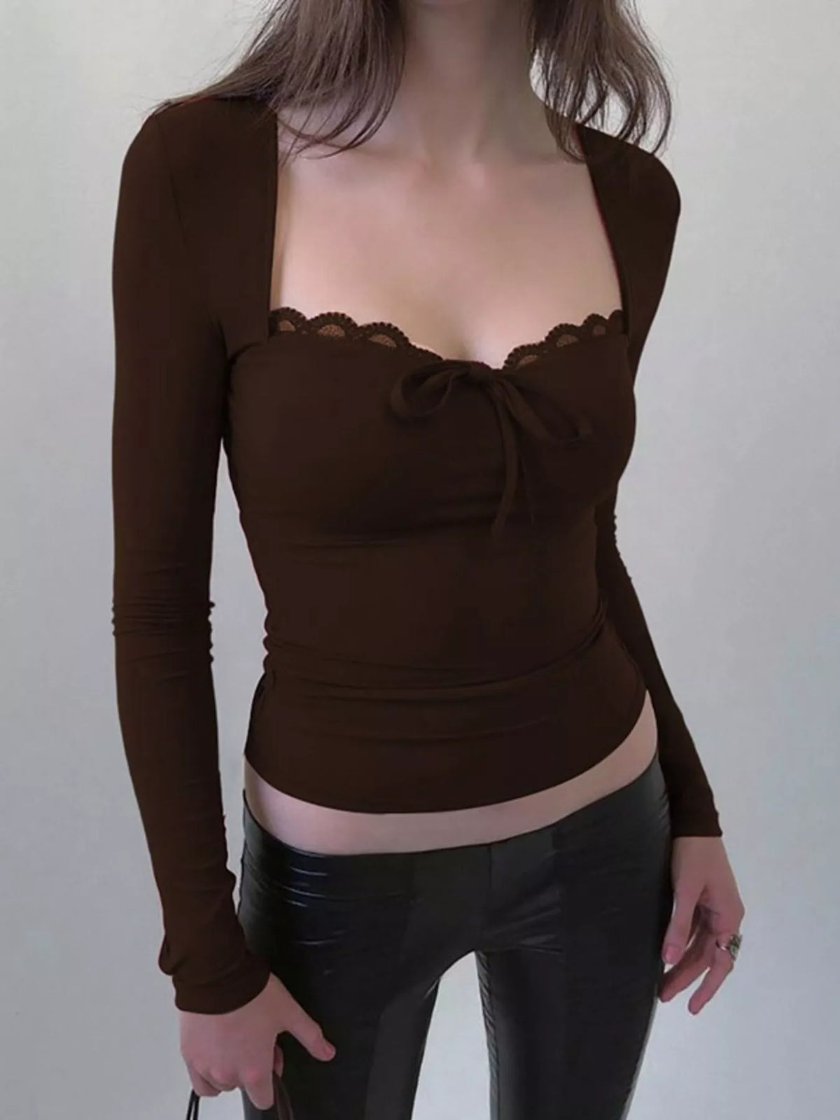 Lace trim long sleeve T-shirt from Plush Fashion Hub, featuring soft fabric and delicate lace details on the sleeves.