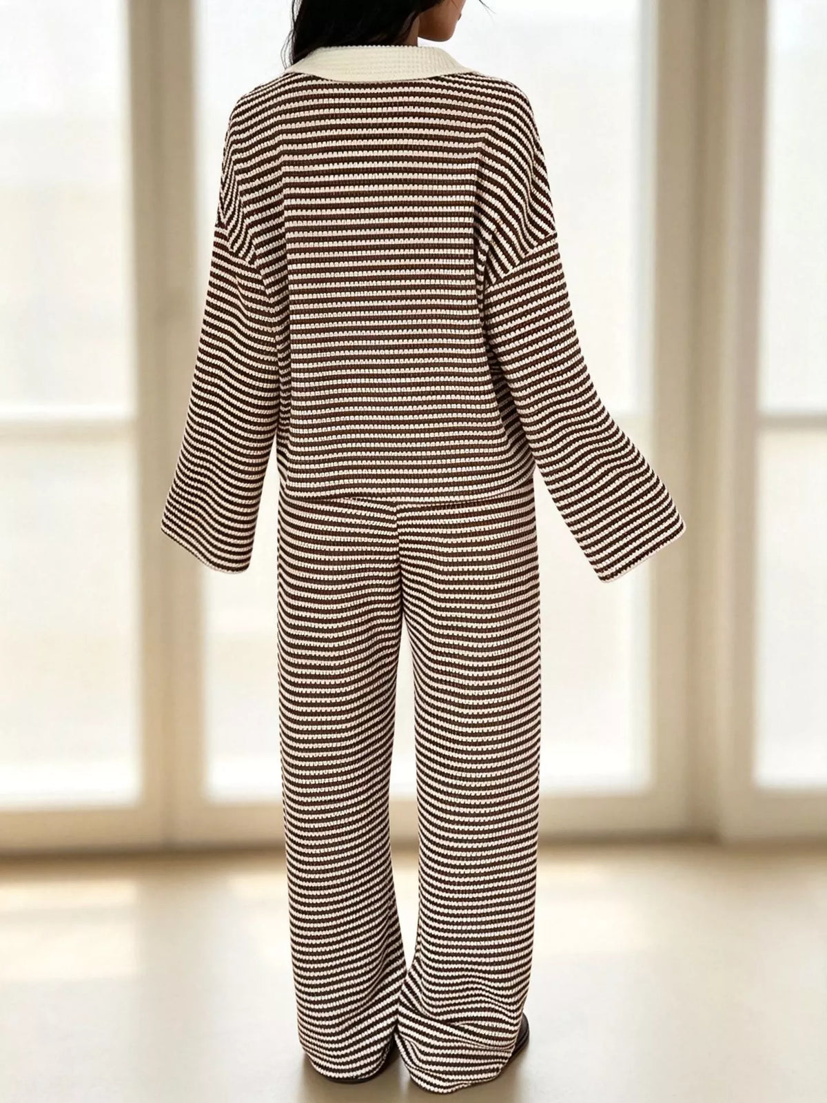 Striped long sleeve polo and wide-leg pants set by Trendsi, featuring a stylish coordinated outfit with bold stripes.