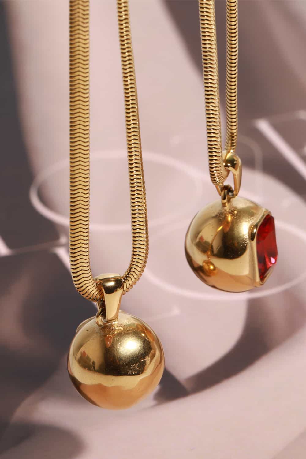 18K gold-plated geometrical zircon pendant necklace with modern design, featuring a shiny zircon stone on a delicate chain.