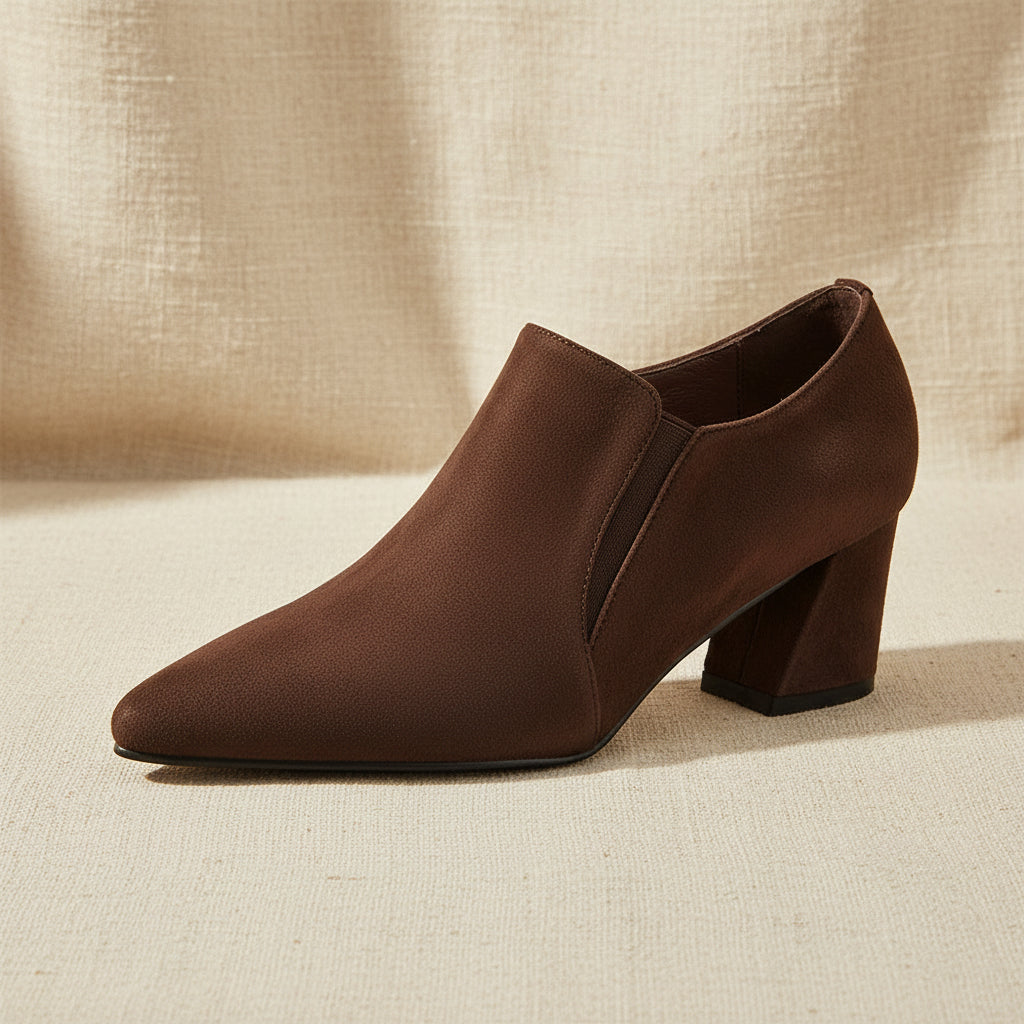 Women's suede pointed toe pumps with chunky heels and deep vamp design, featuring a low heel from Plush Fashion Hub.